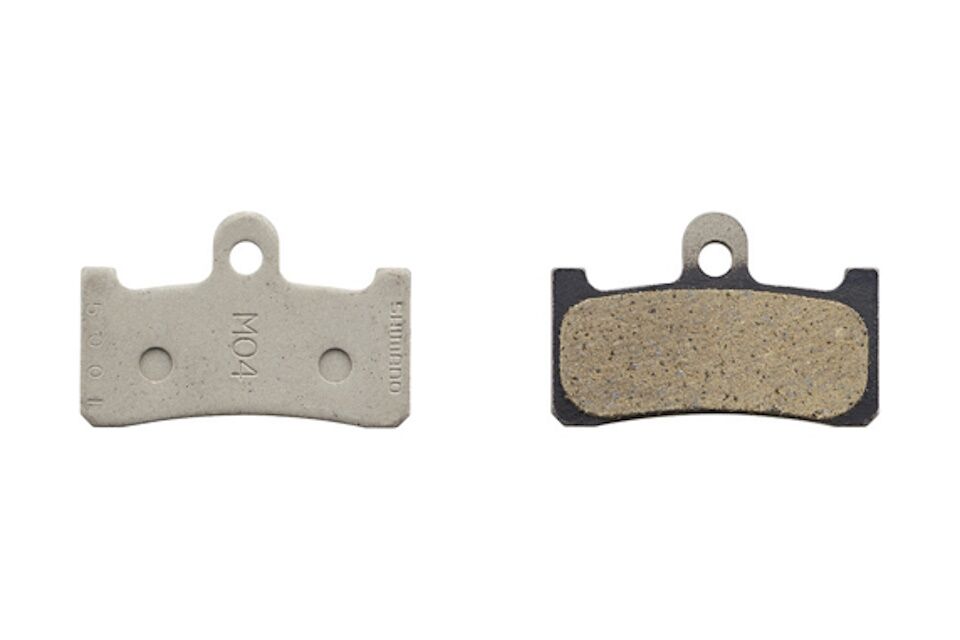 Pastillas de freno de resina Shimano M04-RX y muelle - Imagen 2